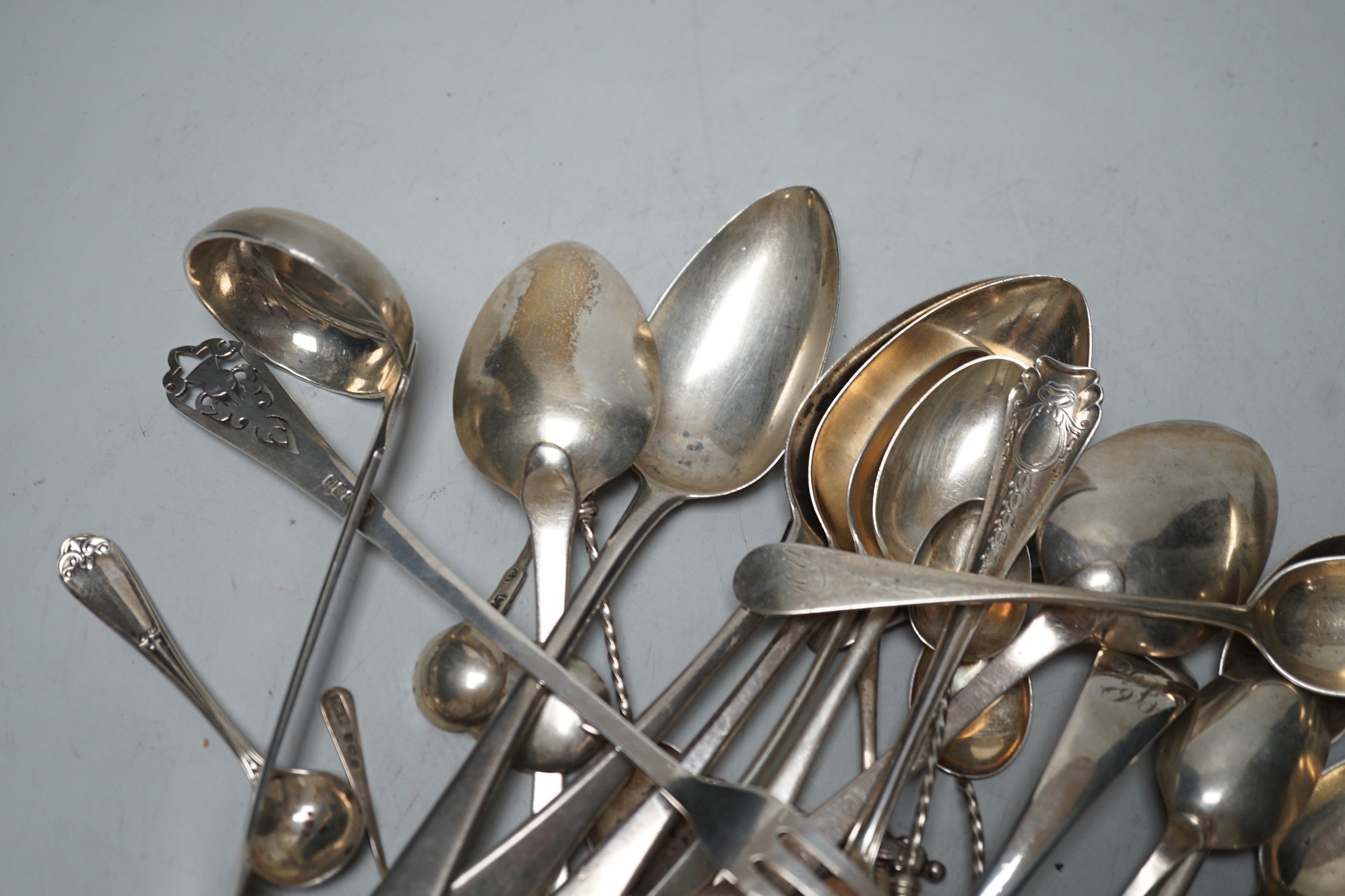 Assorted 19th century and later silver flatware, including dessert spoons, coffee spoons, two ladles, pickle forks, etc. various date and makers, 18.8oz.